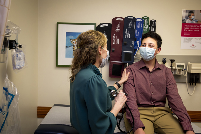 Reeyan Ahmed talks with English Flack, MD, MS, during a recent appointment at Monroe Carell Jr. Children’s Hospital at Vanderbilt. (photo by Susan Urmy)