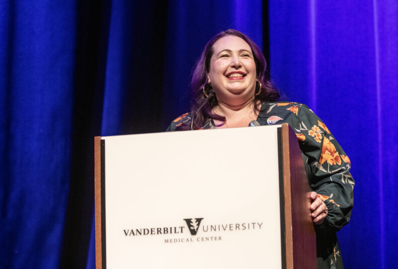 Jillian Williams, MBA, chair of the StrategyShare 2024 Committee and director of Business Development Operations in Population Health, introduces the event’s program. (photo by Erin O. Smith)