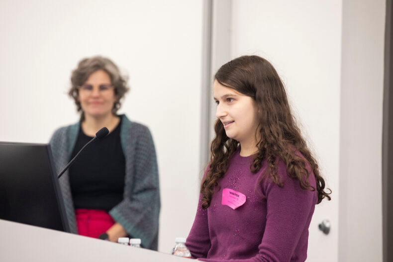 Maggie Weiss describes her experience with histoplasmosis during a clinical presentation at the Vanderbilt Medical Laboratories. In the background, Romney Humphries, PhD, executive medical director of Pathology and Clinical Laboratory Services. (photo by Susan Urmy)