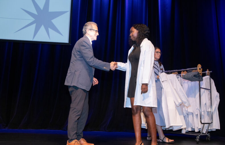 Walter Chazin, PhD, congratulates new IGP student Imani Douglas, a Chicago native who grew up in Phoenix and graduated from Fisk University. (photo by Susan Urmy) 
