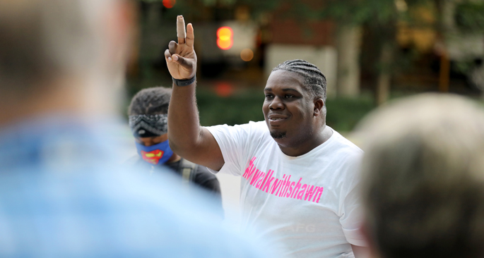Shawn Drumgoole greets neighbors and fellow walkers at his 30th birthday walk. 