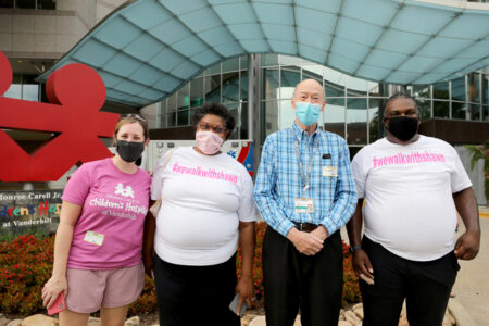 Shawn Drumgoole, right, with, from left, Melissa Danko,MD, surgical director of the ECMO program; Lynne Dunn, Drumgoole’s mother; and John Pietsch, MD, who founded the ECMO program and treated Drumgoole when he was brought to Vanderbilt as an infant.