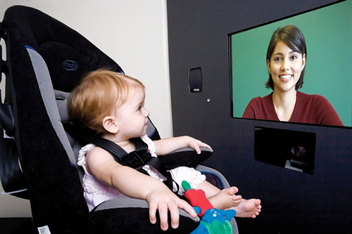 A study participant at Emory University School of Medicine watches a video while an eye tracker records when and where she looks at the screen.