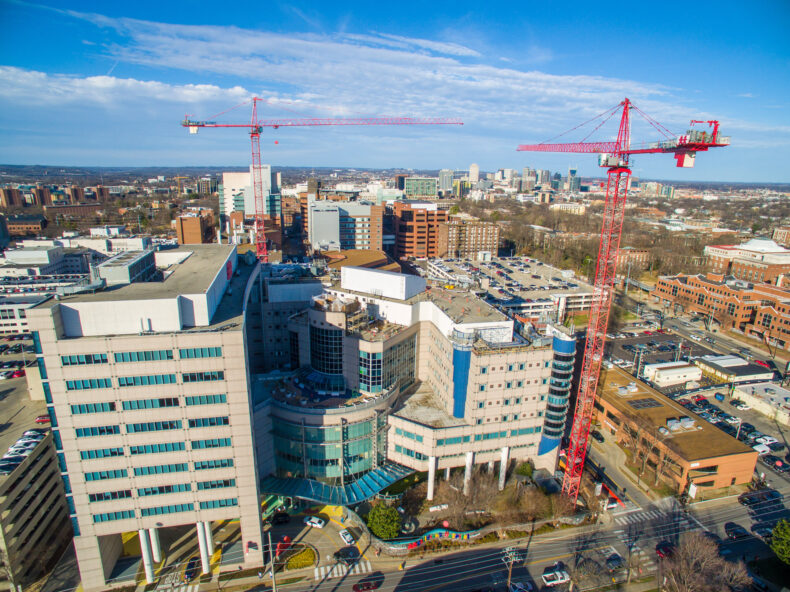 Aerial photos of the expansion construction at Monroe Carell Jr. Children’s Hospital at Vanderbilt. Two cranes were set up to build four floors atop the existing Monroe Carell facility. (photo by John Russell)