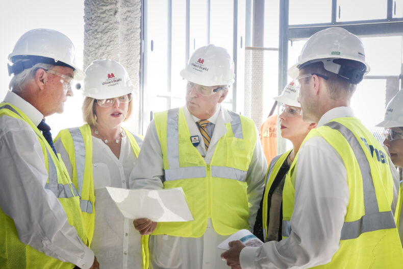Kathryn Carell Brown, Julie Carell Stadler and Edie Carell Johnson, daughters of the late Monroe Carell Jr. and Ann Scott Carell, join hospital leadership and construction planners for a hard hat tour in 2018 to view the progress of the four-floor expansion of Monroe Carell Jr. Children’s Hospital at Vanderbilt. (photo by Susan Urmy)