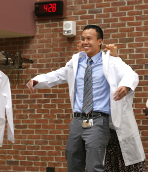 Incoming School of Medicine student James Law was all smiles at last week’s White Coat Ceremony. (photo by Anne Rayner)