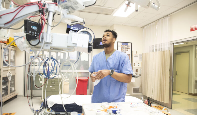 Combat medic and SMART Program rotator Sedrick Stern at work in the adult Emergency Department. (photos by Susan Urmy)