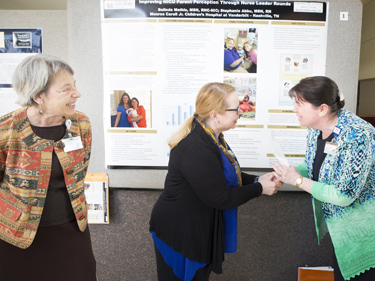 From left, Nancy Wells, DNS, R.N., Sharon Hendrix, DNP, R.N., and Stephanie Abbu, MSN, R.N., CNML, at the recent Nursing Research Poster Presentations. (photo by Susan Urmy)