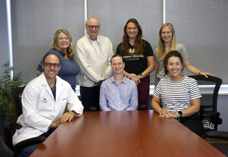 The multidisciplinary team at the Moderate-to-Severe Acquired Brain Injury Clinic includes, front row from left, Michael Wolf, MD; Elizabeth Martin, MD, MPH, MHS; Jane Owen Robbins, OT. Back row from left, Tisha Coggin Clay; Charles Hausman, SLP; Kat Hedden, PT, DPT; and Mackenzie Phillips, SLP. (Photo by Donn Jones)