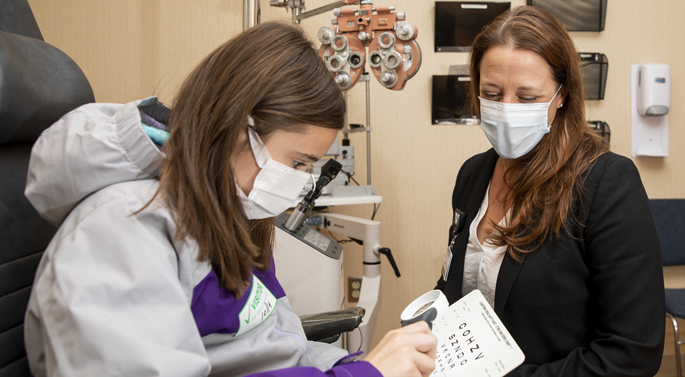 Lori Ann Kehler, OD, gives a low vision exam to patient Mary Elizabeth Parker at the Vanderbilt Eye Institute.