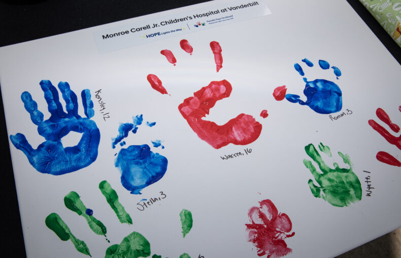Handprints were placed on a canvas during the Hyundai Hope on Wheels event. (photo by Erin O. Smith)