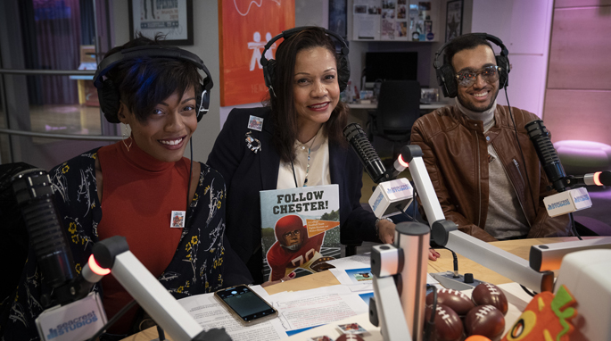 Children’s book author Gloria Churchwell, center, shared the story of her newest picture book, “Follow Chester!,” during her recent visit to Seacrest Studio at Monroe Carell Jr. Children’s Hospital at Vanderbilt. She was joined by daughter, Alexandria Churchwell, and Byard Huggins, a local composer and producer, during a promotional tour of the book that highlights the story of Dr. Chester Pierce, the first African American to play collegiate football in the South.