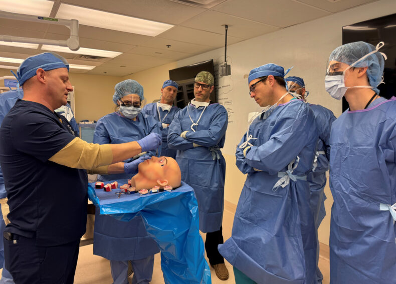 PHOTO 3: Col. Matthew Kuhnle, DO, an ophthalmologic surgeon from Blanchfield Army Community Hospital, on left, reviews a lateral canthotomy, a surgical procedure for managing ocular trauma, during the recent ASSET+ course at Vanderbilt University Medical Center.
