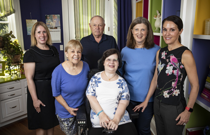 Sharon Kantanie, center, participated in the study of a drug that reduced soft-tissue flare-ups and the prevented new areas of abnormal bone formation. With her are, from left, Emily Shardelow, clinical/translational research coordinator; Sharon’s parents, Mary and Stan Kantanie; Margo Black, MSN, manager of research projects for Metabolic Bone Disorders; and Kathryn Dahir, MD, professor of Endocrinology and Diabetes. (photo by Erin O. Smith)