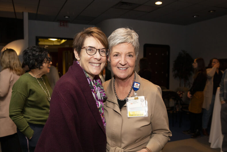 Janet Cross, MEd, CCLS, CPXP, right, with Med Rush, MD, at a recent event celebrating Cross’ career. (photo by Susan Urmy)