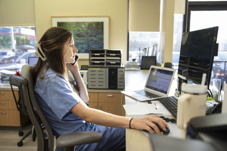 First-year medical student Julianne Strauch, calls patients to remind them of upcoming appointments. (photo by Susan Urmy)