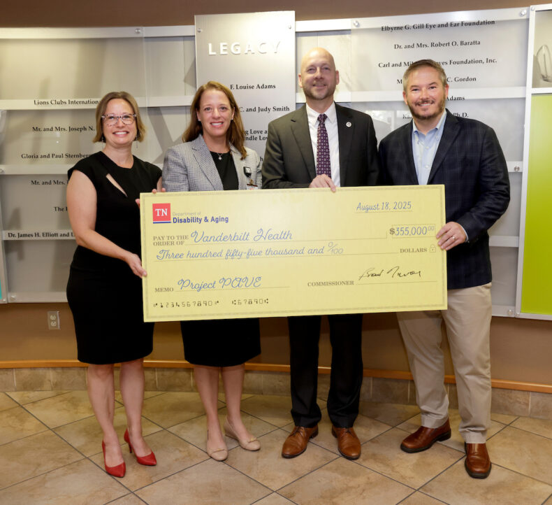 Tonia Rex, PhD, left, Lori Ann Kehler, OD, Brad Turner and Tennessee Sen. Jeff Yarbro pose for a photo at the Project PAVE check presentation. (photo by Donn Jones)