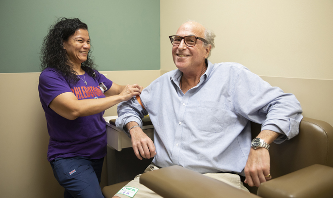 Photo of Adam Dread being cared for by Yasmine Fisher during a visit to the Anticoagulation Clinic at Vanderbilt Heart and Vascular Institute.