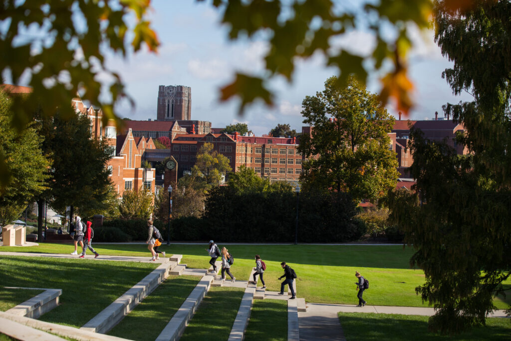 Students walk past the Humanities Amphitheatre with Ayres Hall in the backgroud