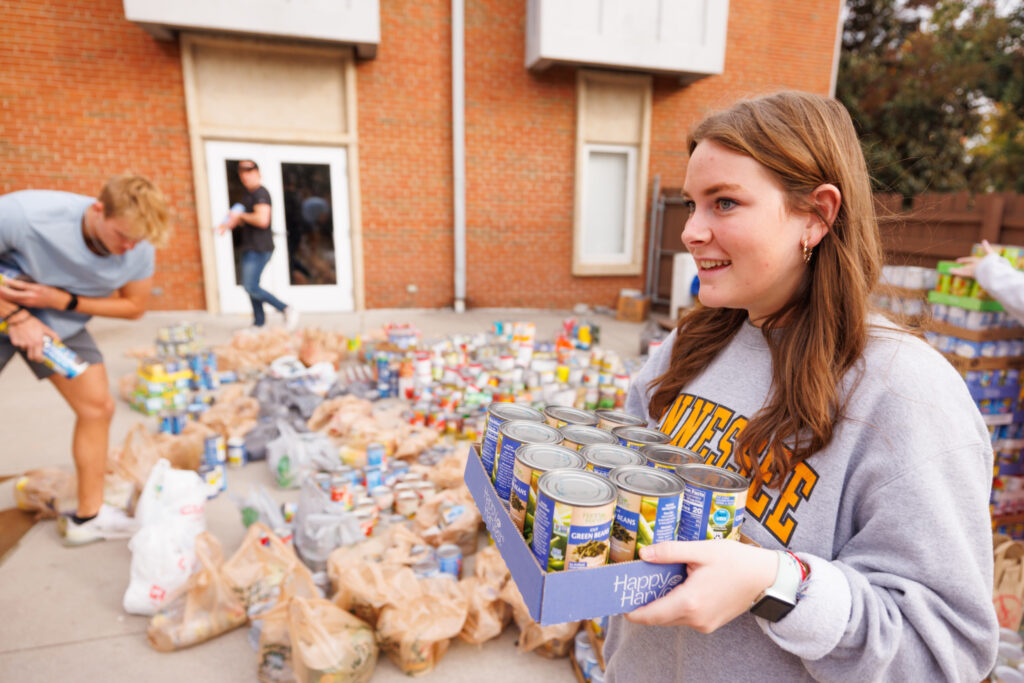 Students participate in Tower of Cans hosted by All Campus Events (ACE) to benefit the Knoxville Community and Smokey's Pantry through FISH on November 06, 2024. Photo by Steven Bridges/University of Tennessee. Organizations are asked to collect cans then compete to build the tallest tower out of their donations. The scores from this event reflects the amount of each organizations overall donations and the height of their tower.