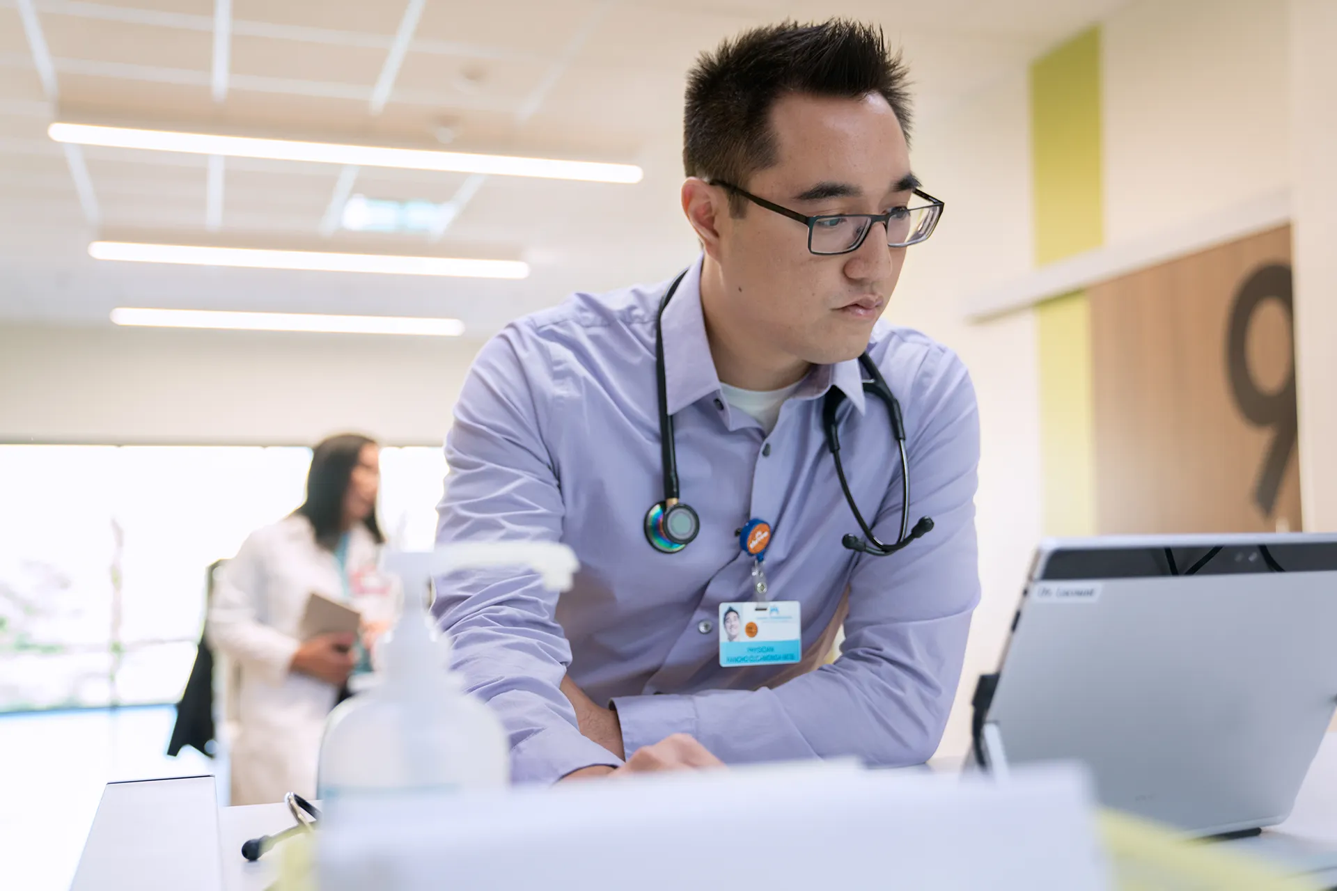 Doctor at desk on laptop