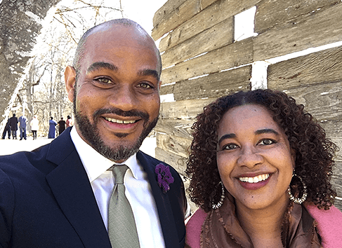 Couple taking a smiling selfie together, capturing a moment of joy and affection.