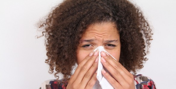 woman sneezing