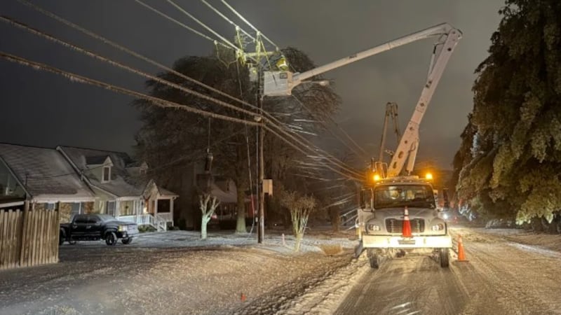 A CEMC lineman works on a power line in Clarksville, Tennessee.
