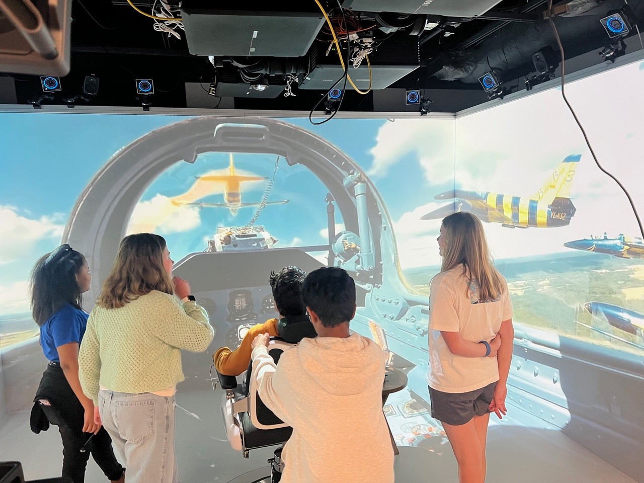 Career Connections students use flying simulator.