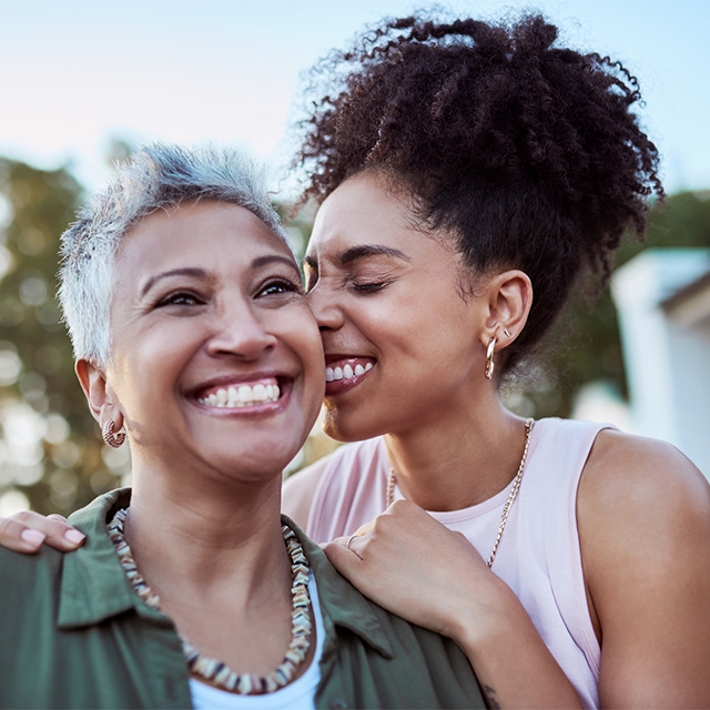 Daughter hugging mother