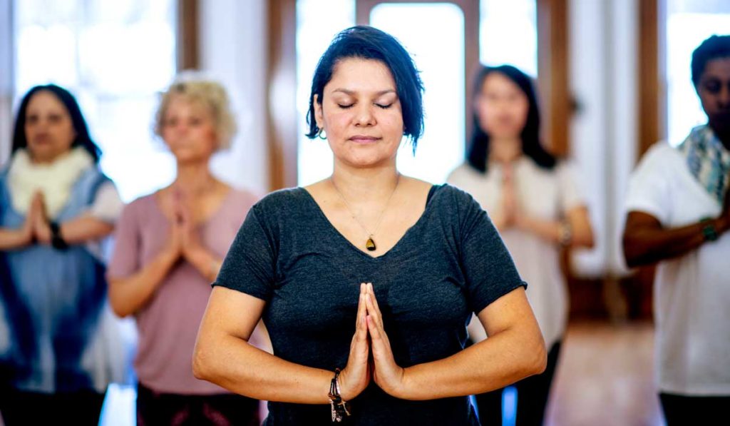 Women participating in a mindfulness and medicine session.