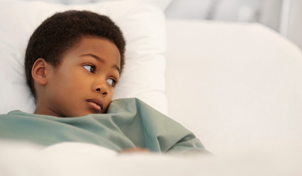 Sick kid looking uncomfortable