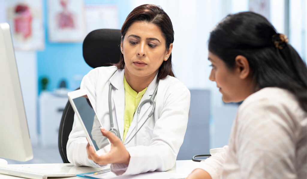 Doctor showing patient EHR results