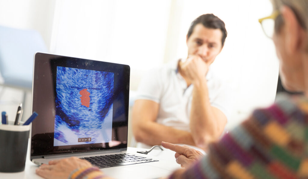 Physician reviewing prostate ultrasound with patient
