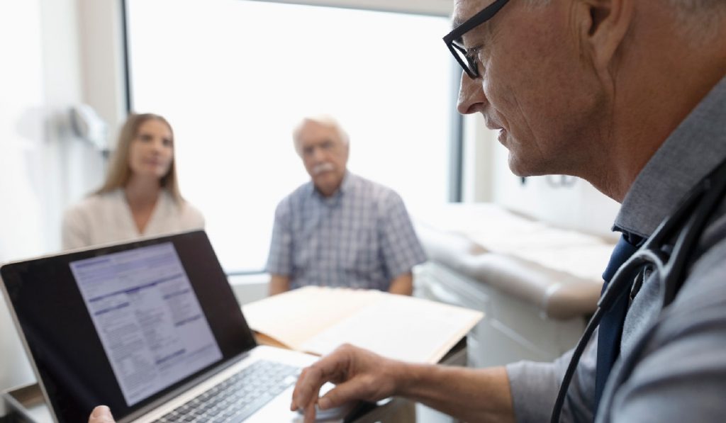 Vartgez Mansourian, M.D. consulting with a patient