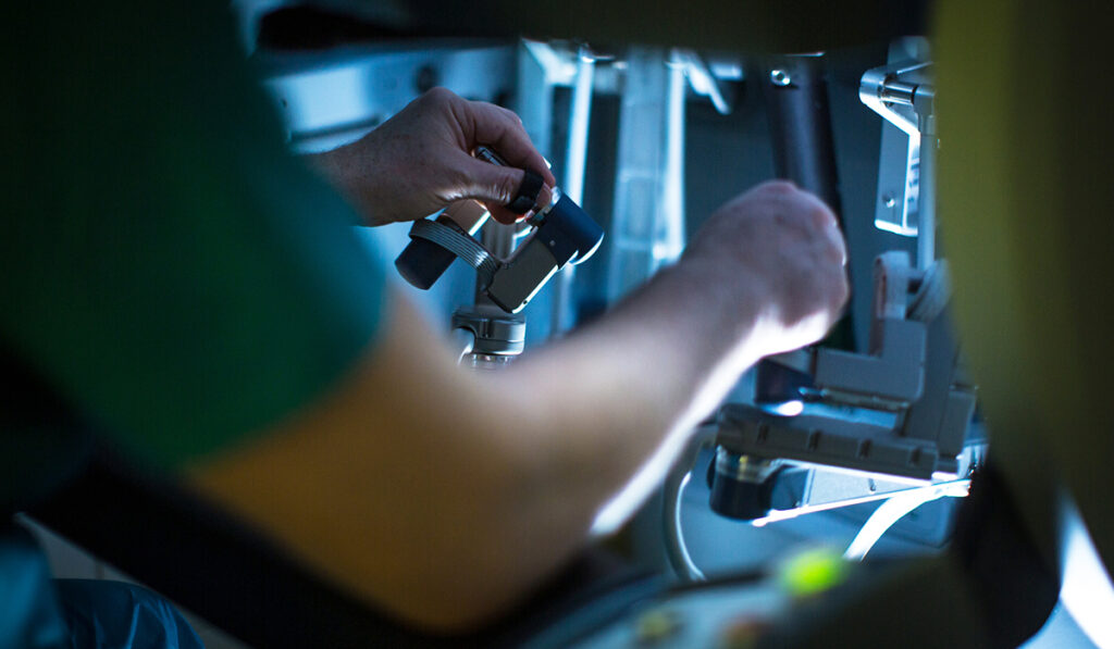 surgeon using robotics