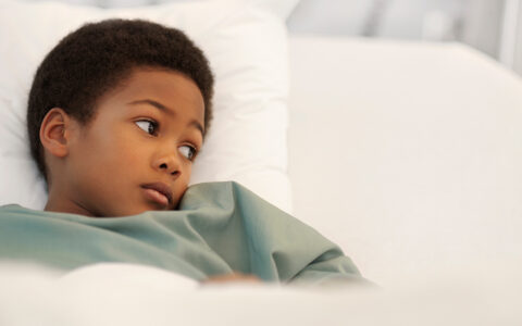 Sick kid looking uncomfortable