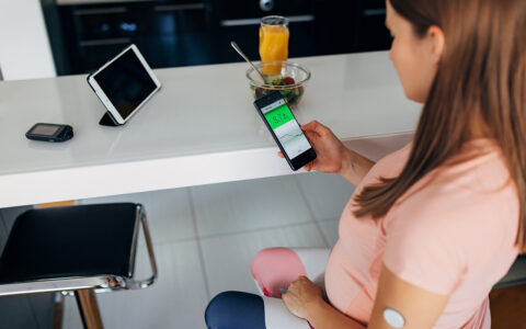 Woman using telemedicine to check glycemic levels