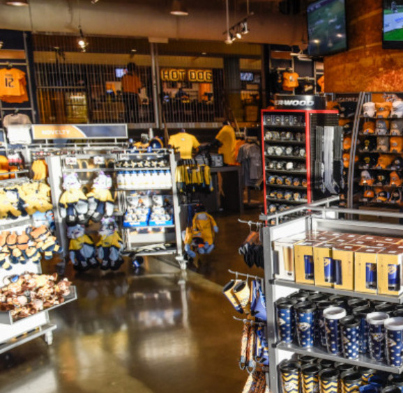Baby smiling while wearing Columbus Blue Jacket gear