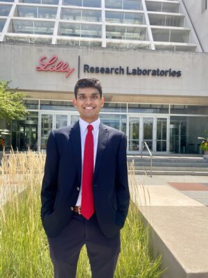 A photo of Shanay outside the Eli Lilly and Company building.