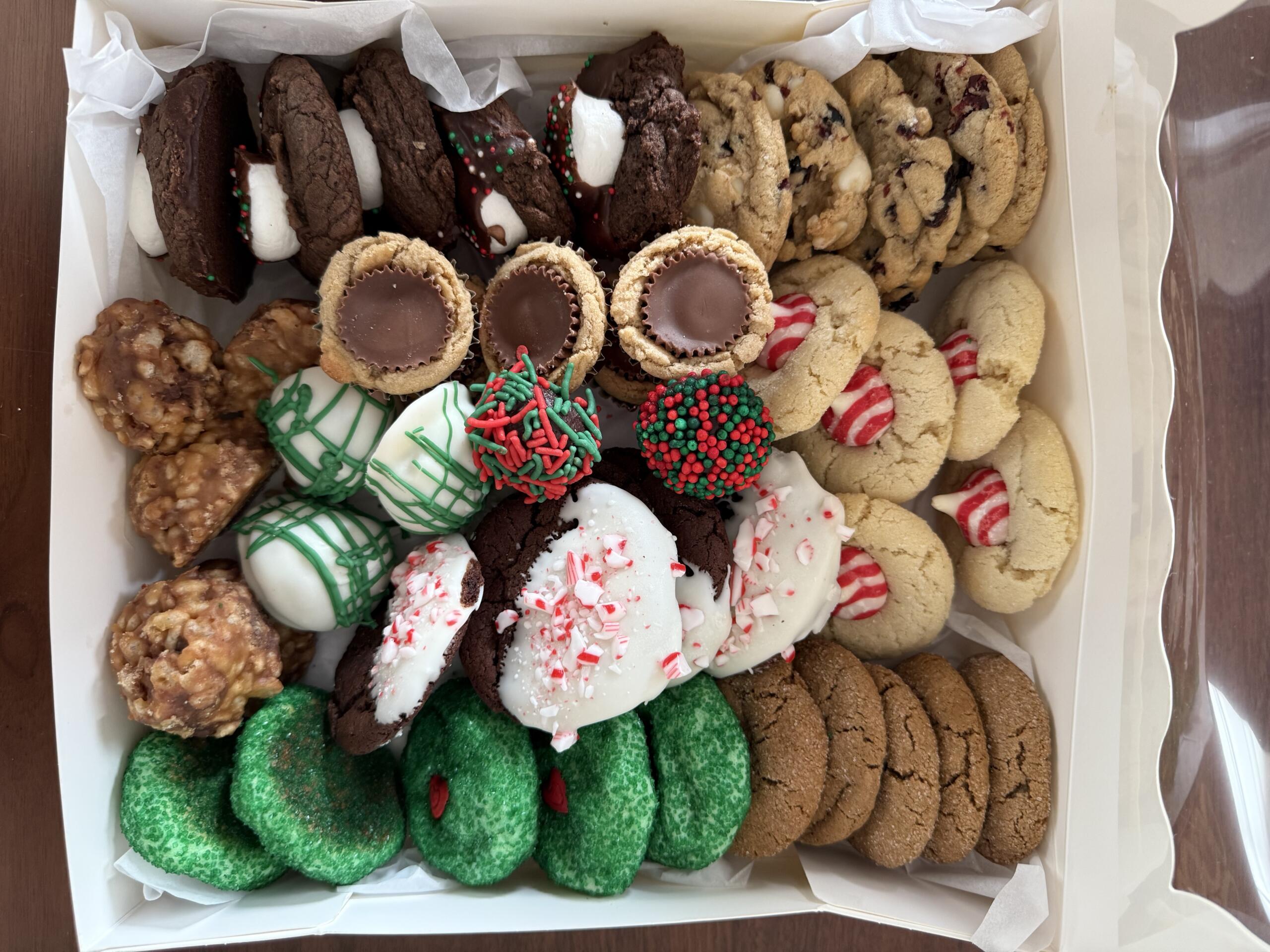 A box filled with 10 different types of Christmas cookies.