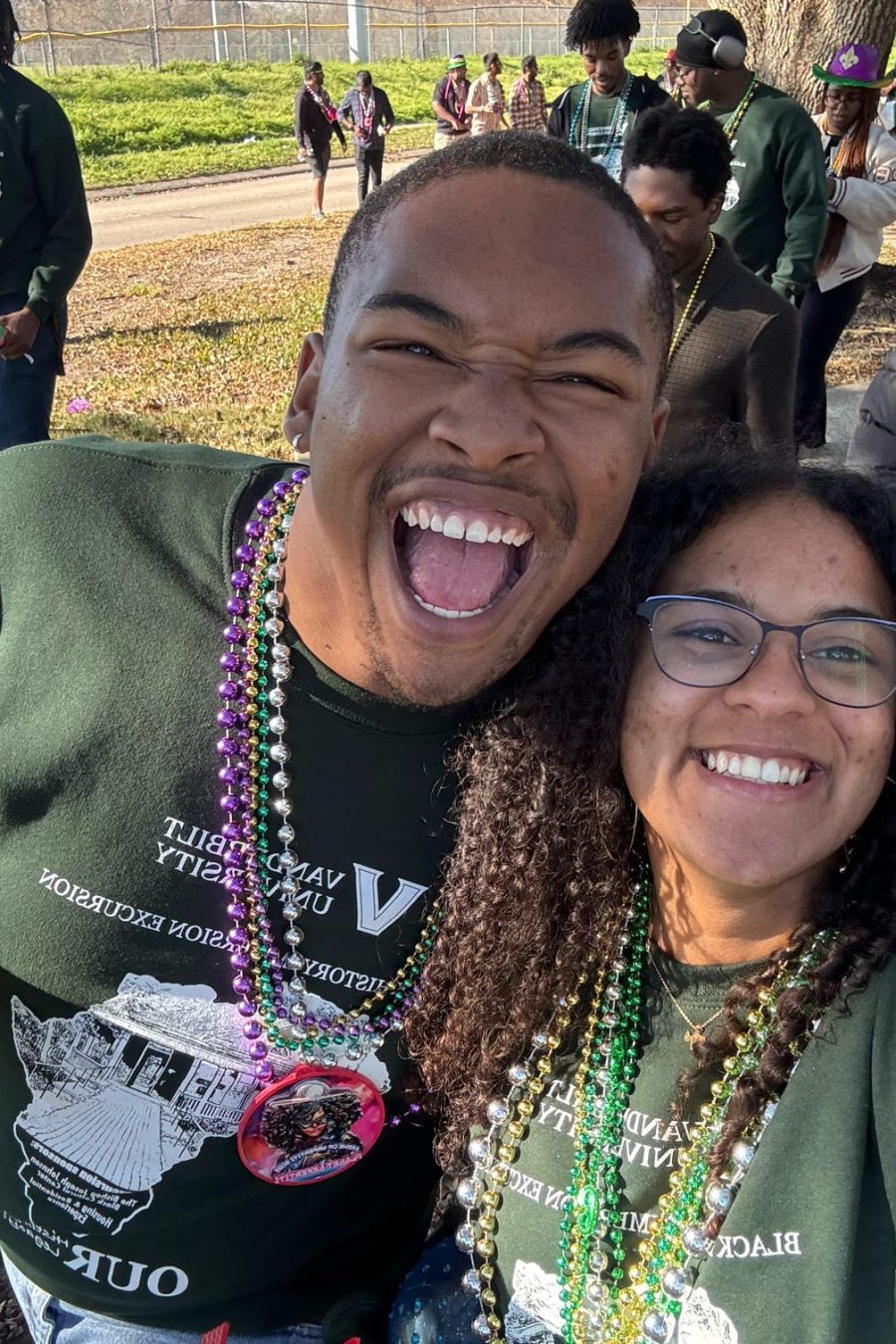 Students smiling supporting the BCC at an event.