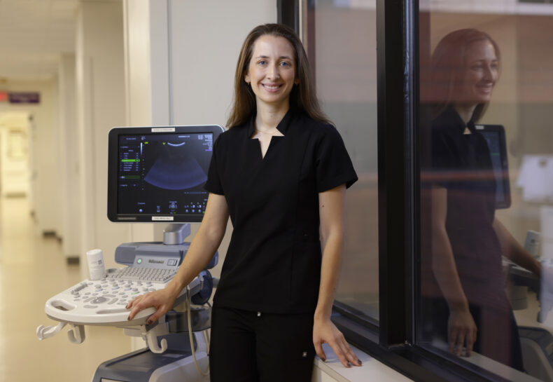 Alexandra Sundermann, MD, PhD, poses for a photo with an ultrasound machine. (photo by Donn Jones)