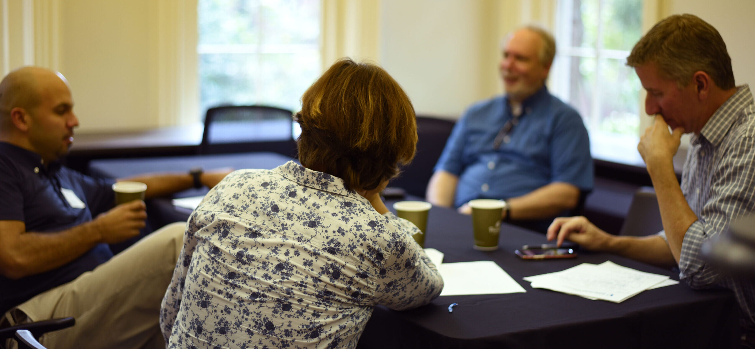 faculty sitting around a table