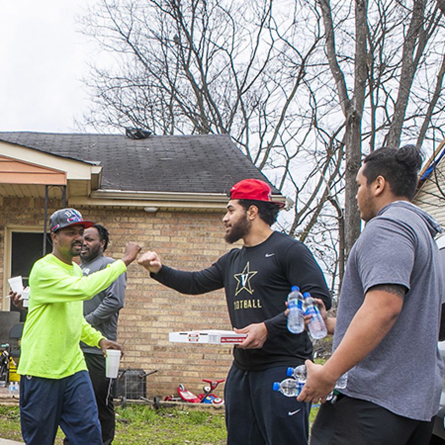 Vanderbilt senior, Mo Hasan, football teammates, and other students pass out meals and water for Nashville community in North Nashville after devastating tornado. Vanderbilt University Photo: Anne Rayner; VU