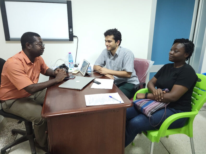 Surya Gangavarapu, MD, resident in Neurological Surgery, meets with local researchers at a VUMC partner site in West Africa.