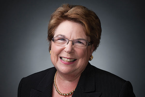 studio portrait of Dean Linda Norman wearing black suit