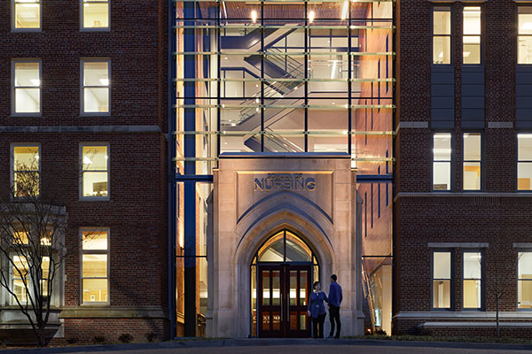 Glass entrance to VUSN building at night
